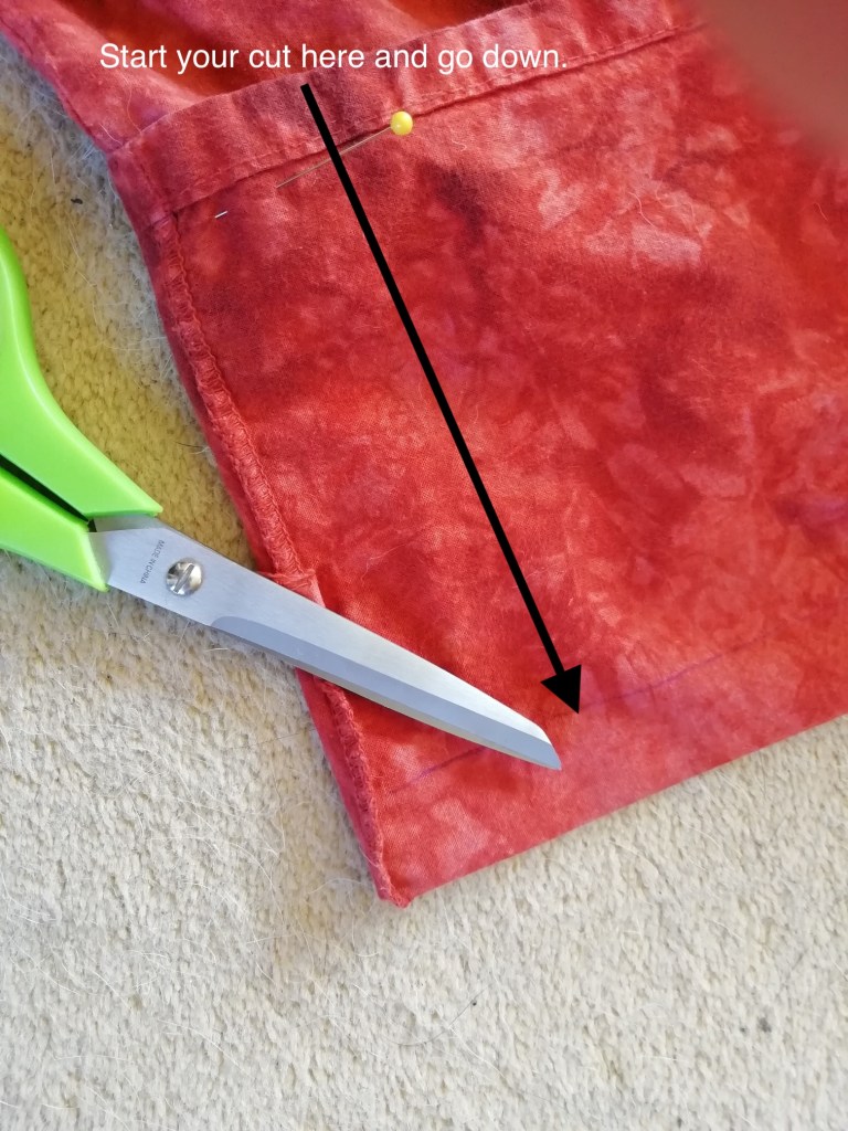 An arrow indicates the direction of the first cut.